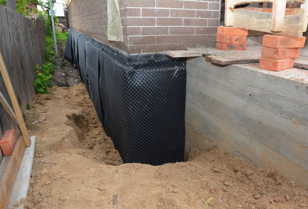 Happy homeowners after waterproofing job in West Lafayette